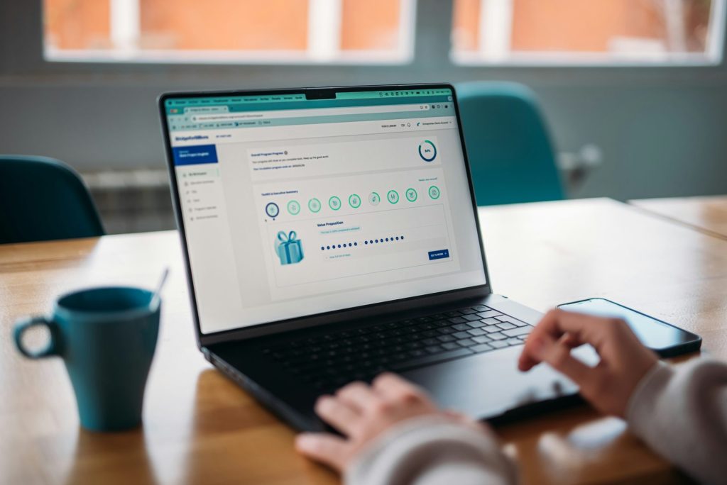 Person using a laptop to review a rewards program.